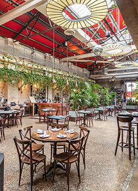 A-restaurant-with-high-ceilings-and-greenery-for-events