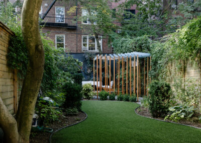 Casa Olympia backyard rental space with lush greenery