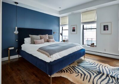 cocoon boto Master bedroom with blue accent wall two windows and views