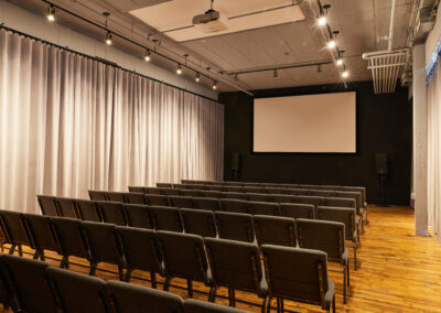 02 Casa Kino Event Space with Projector Screen and Chairs