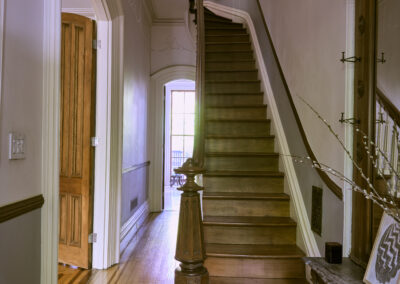 casa maritza event space with staircase in hallway