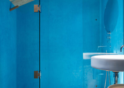 28 Casa Cometa Space Rental Interior Primary Bathroom vertical with blue walls and glass shower