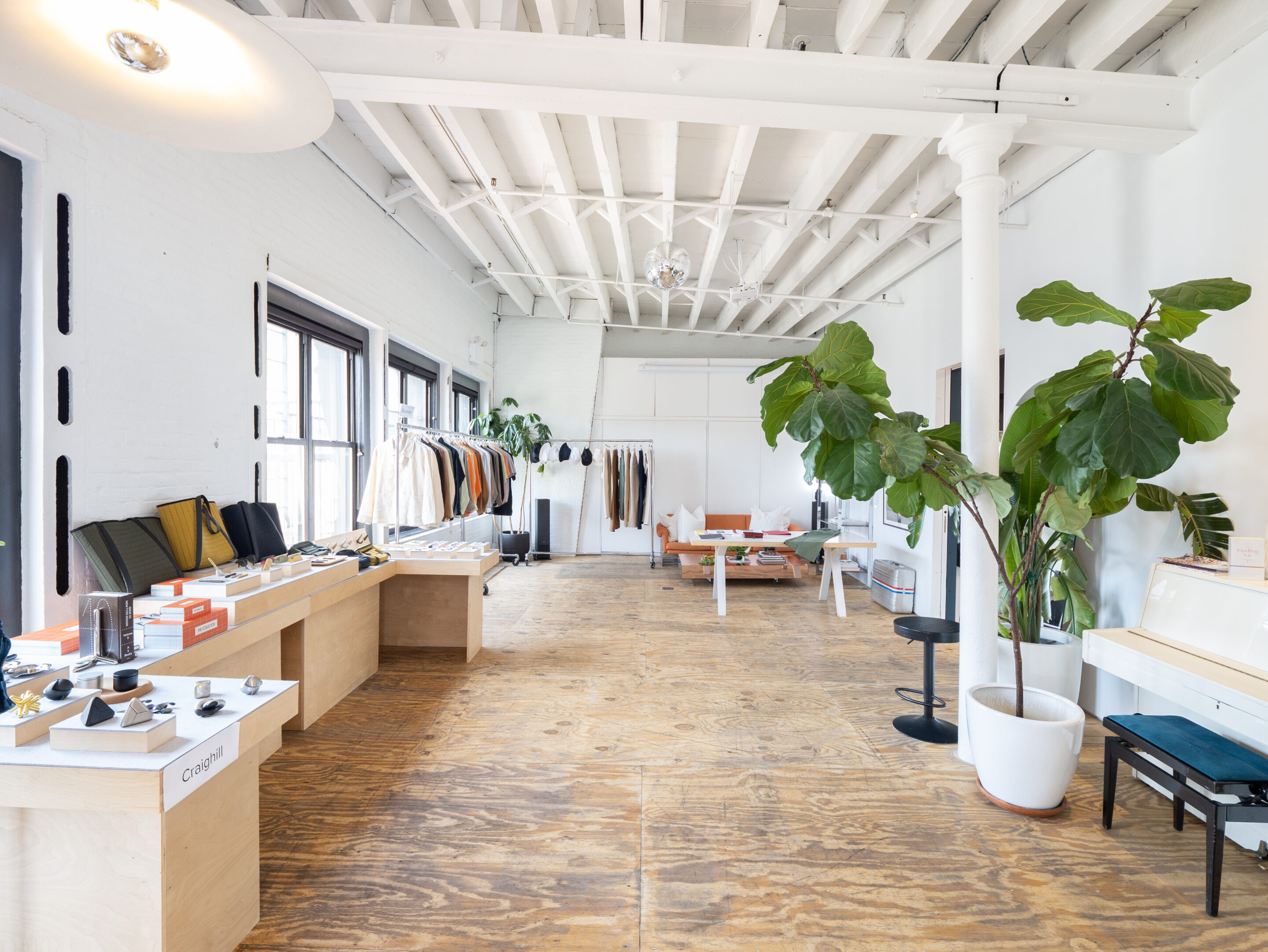 casa janka fashion showroom space rental_nyc loft in little italy white studio with high ceilings clothing racks accessories display
