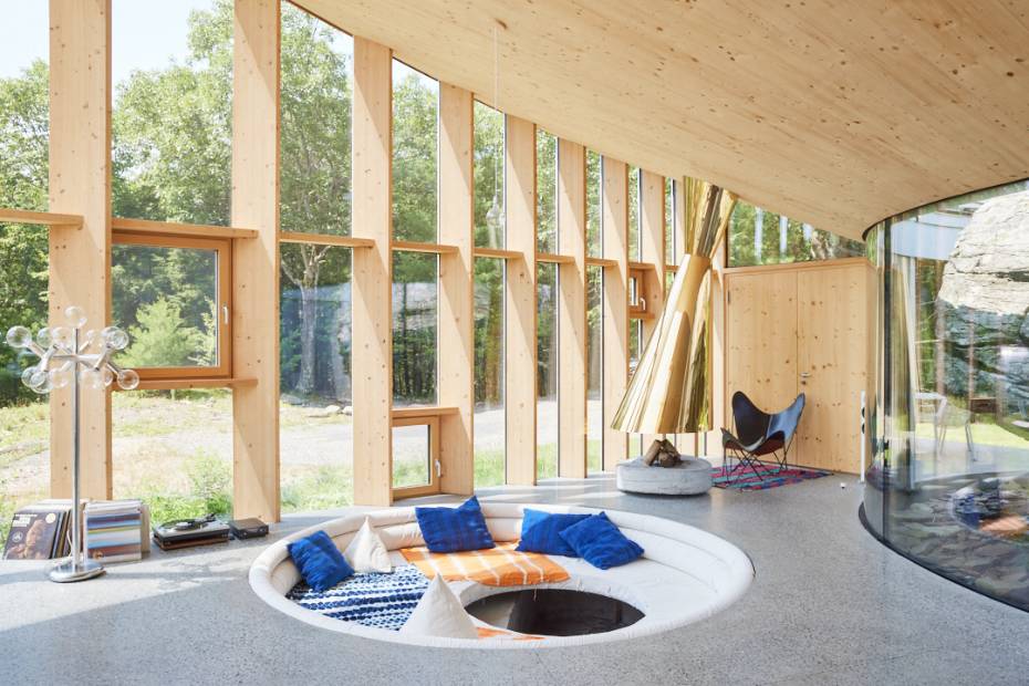cocoon casa cometa living area wood ceiling glass windows