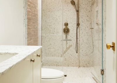 cocoon casa strand guest bathroom marble shower vertical