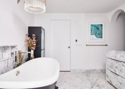 cocoon casa strand master marble bathroom back view chandelier details